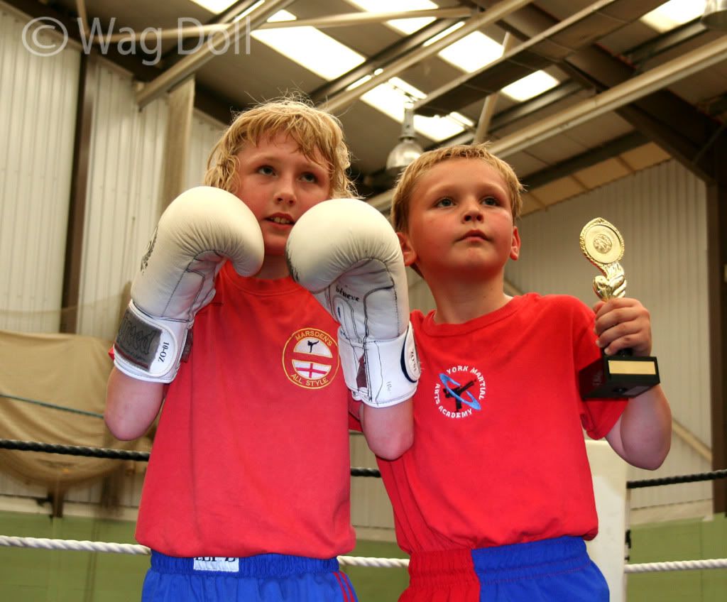 children with trophy and boxing gloves